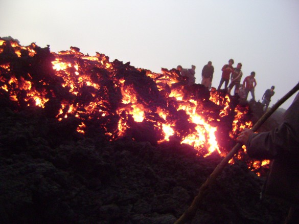Hikers looking at the lava Hikers looking at the lava