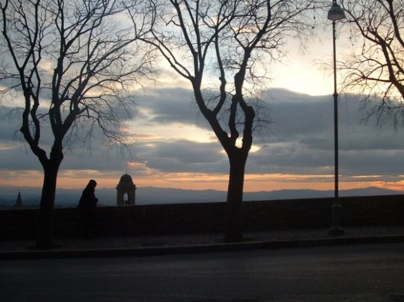 A lone traveler hurries home in Perugia, Italy.