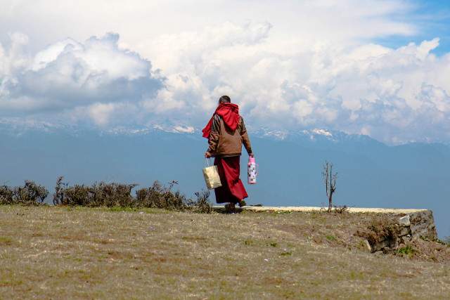 Monk at Dochu La Pass
